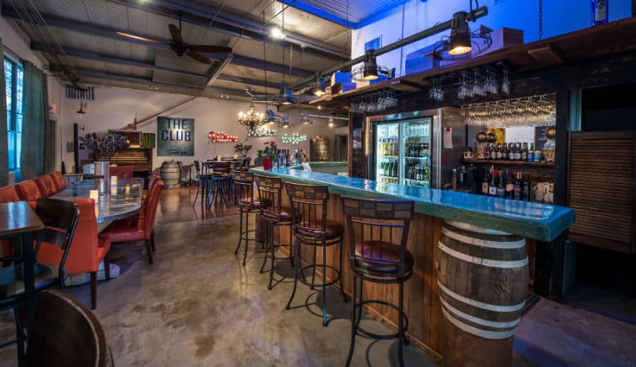 Rustic bar with stools and a long table